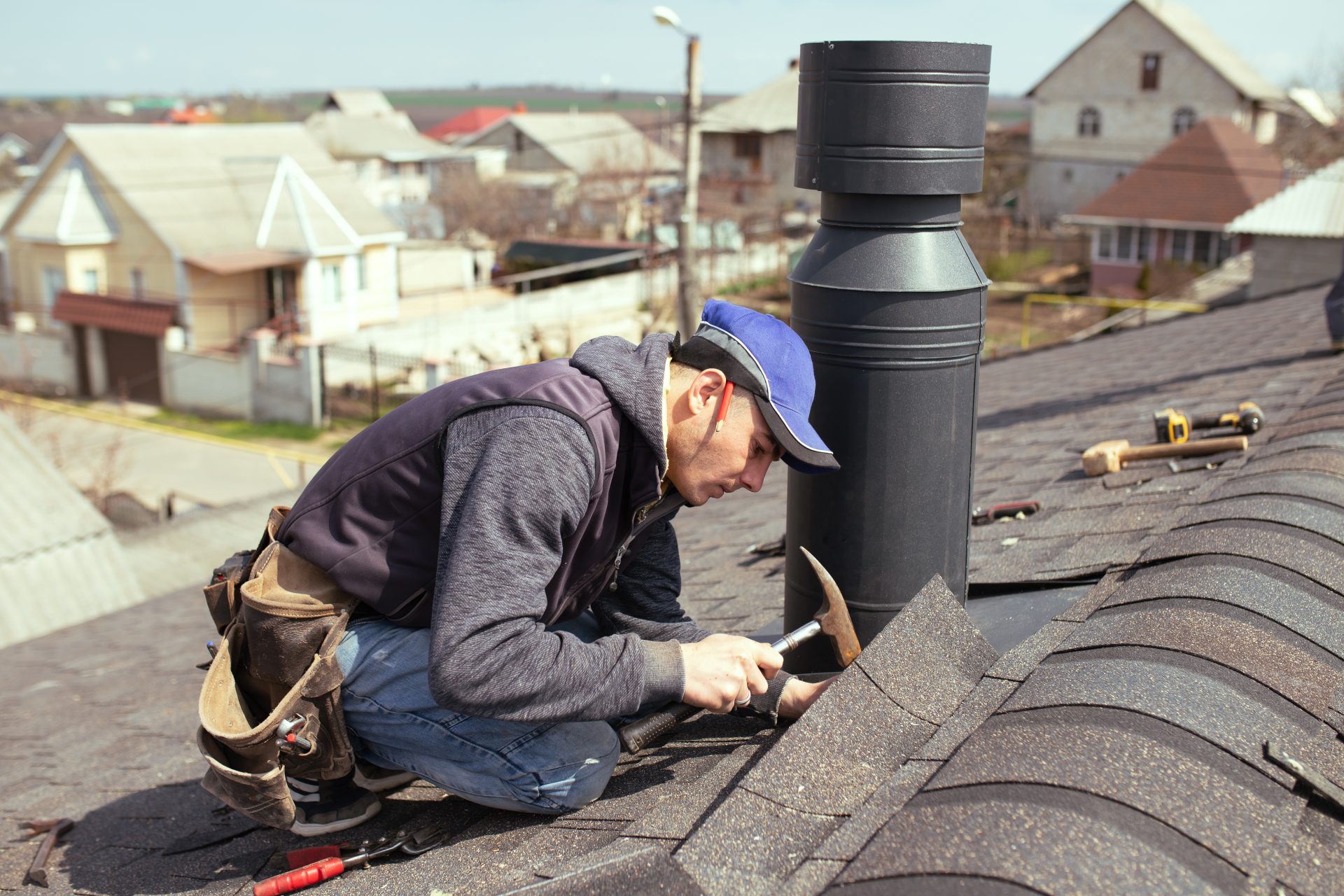roofer placing shingles